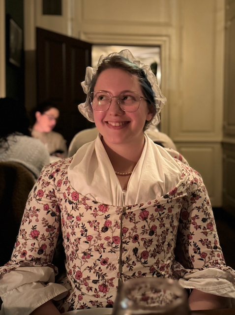 Abby in 18th century garb in a tavern at Colonial Williamsburg.